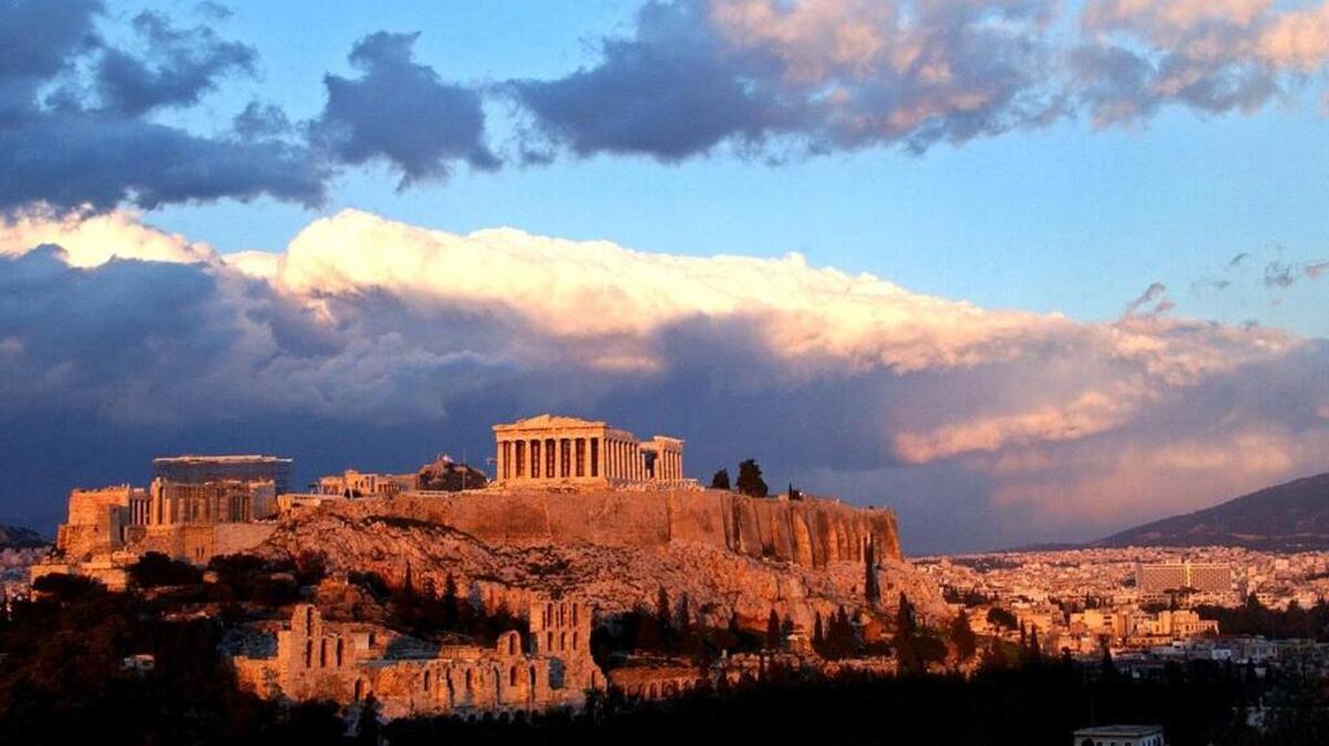 Sunlight catches clouds behind the ancient Acropolis in Athens in this 2004 file photo. The map says Athens is unquestionably a European metropolis. Even the name of the continent comes from Greek mythology.