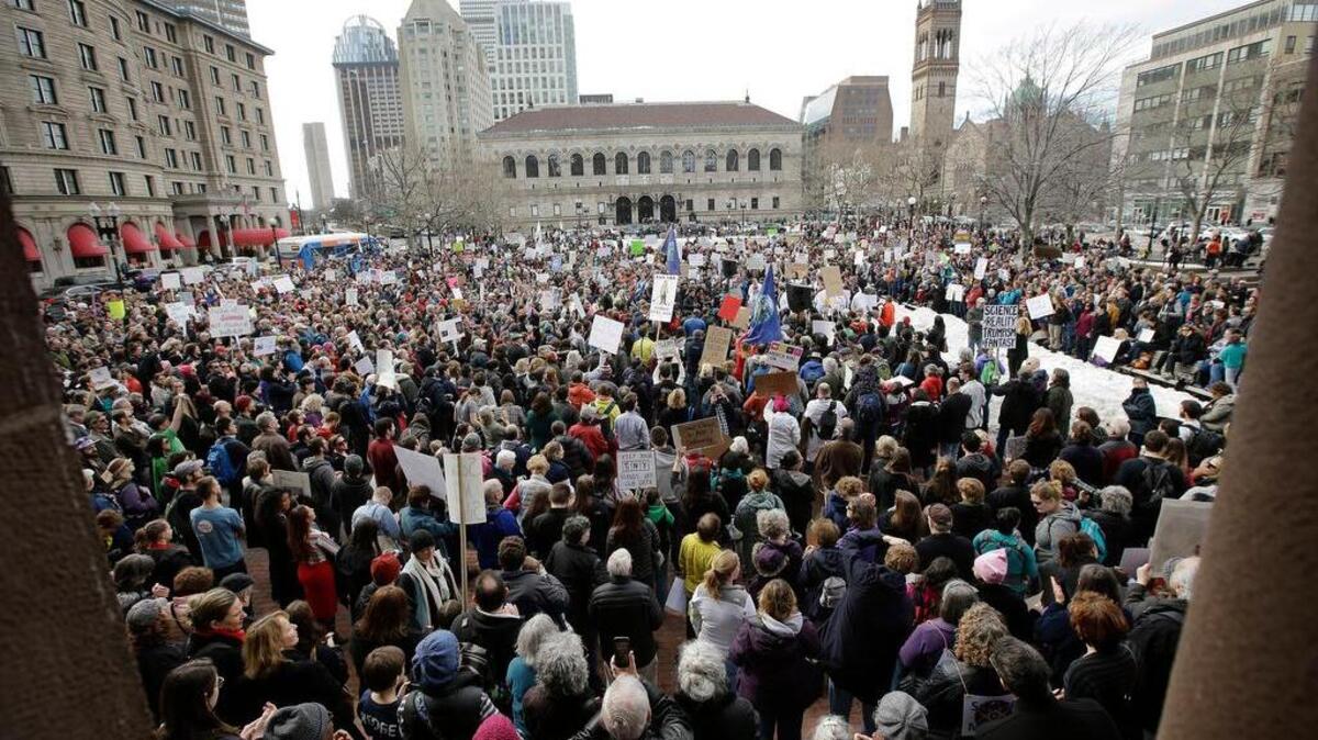 Members of the scientific community, environmental advocates and supporters demonstrate Feb. 19 in Boston to call attention to what they say are the increasing threats to science and scientific research under the administration of President Donald Trump.
