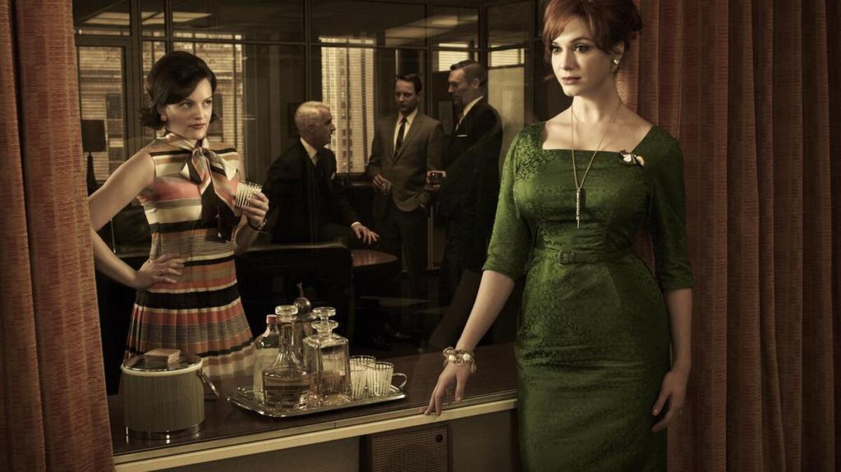 (Front) Peggy Olson (Elisabeth Moss) and Joan Harris (Christina Hendricks- (Back) Roger Sterling (John Slattery), Pete Campbell (Vincent Kartheiser) and Don Draper (Jon Hamm) - Mad Men - Season 5