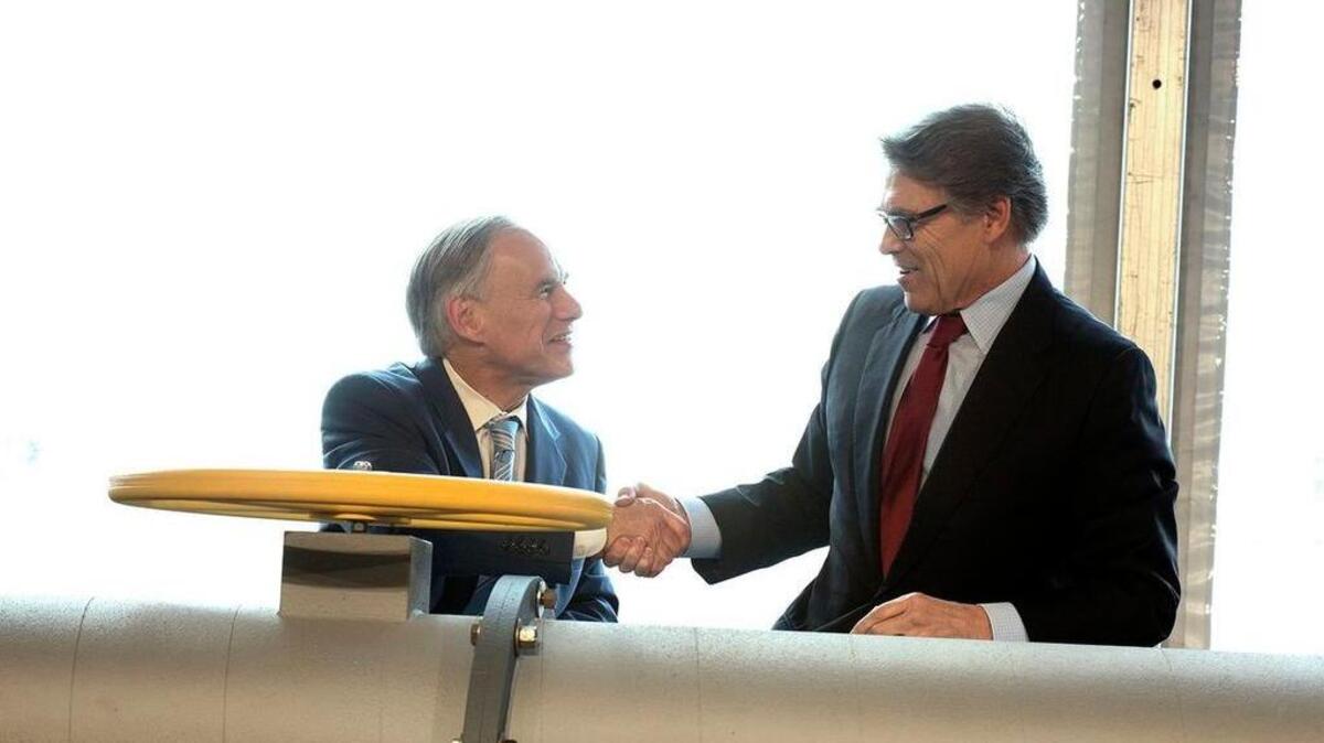 Texas Gov. Greg Abbott, left, and U.S. Secretary of Energy Rick Perry appeared at a ribbon cutting ceremony at the Petra Nova Power Plant in Thompsons on April 13, 2017.