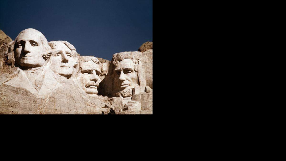 
File - This undated file photo shows the statues of George Washington, Thomas Jefferson, Teddy Roosevelt and Abraham Lincoln at Mount Rushmore in South Dakota. 
