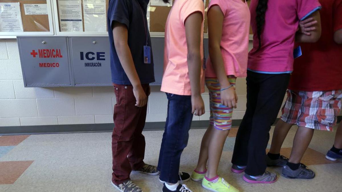 Children line up in the cafeteria at a South Texas center that’s a temporary home for immigrant women and children detained at the border.