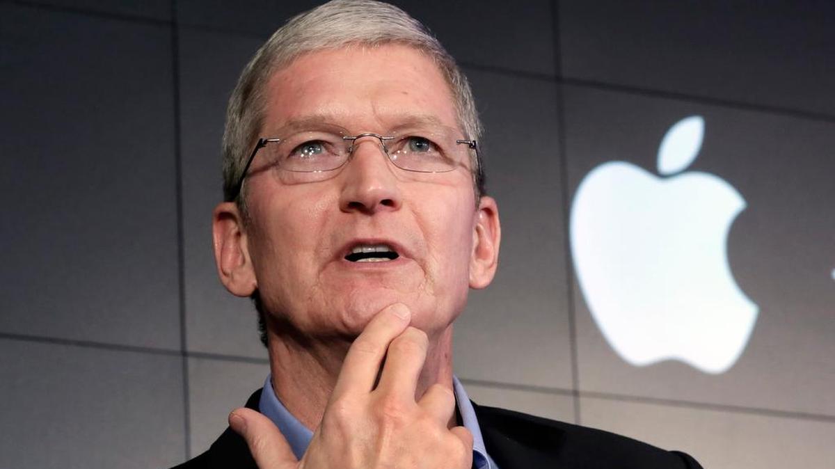Apple CEO Tim Cook responds to a question during a news conference in New York.