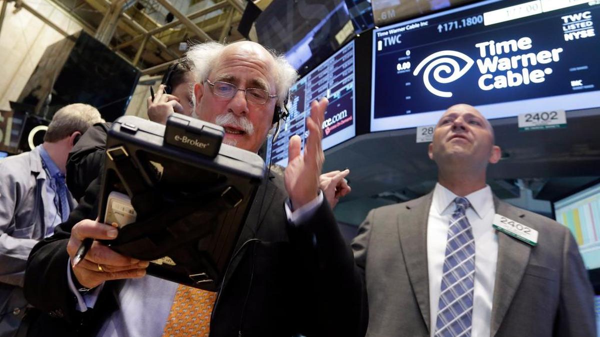 Trader Peter Tuchman, left, and specialist Jay Woods at the New York Stock Exchange.