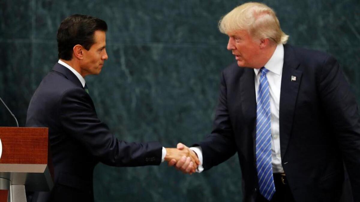 Mexico President Enrique Pena Nieto and Donald Trump shake hands Aug. 31 after a joint statement at Los Pinos, the presidential official residence in Mexico City.