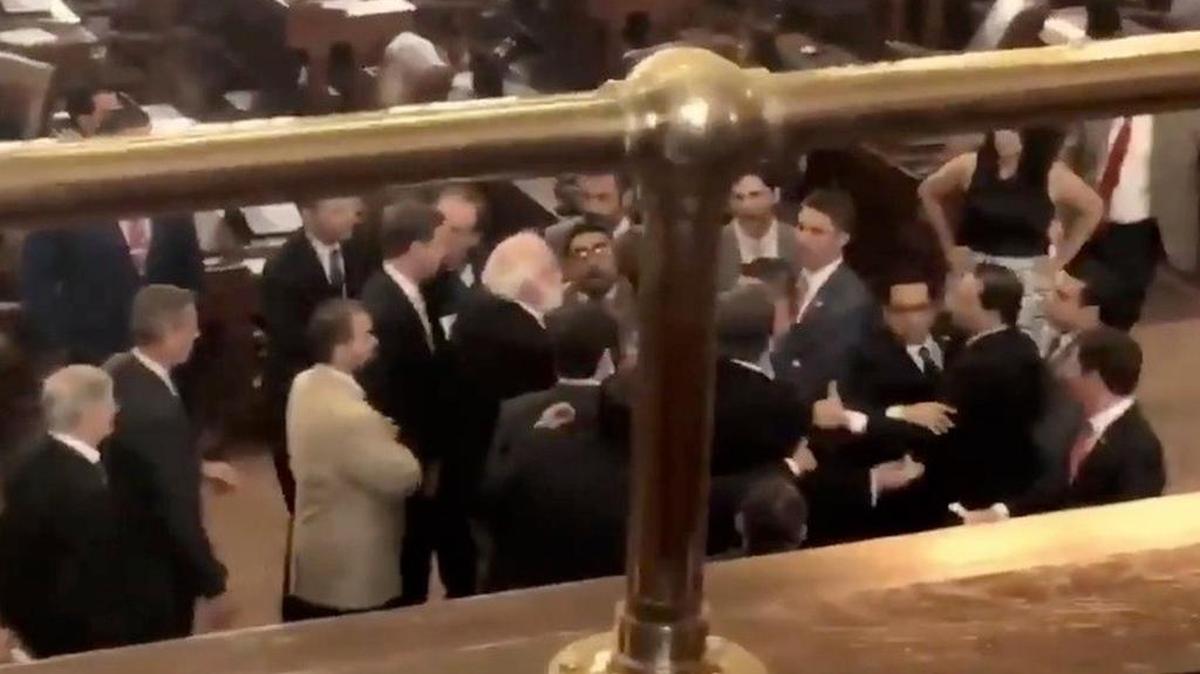 Following a "sanctuary cities" ban protest in the gallery, lawmakers tussle on the House floor on May 29, 2017 — the last day of the 85th regular legislative session.