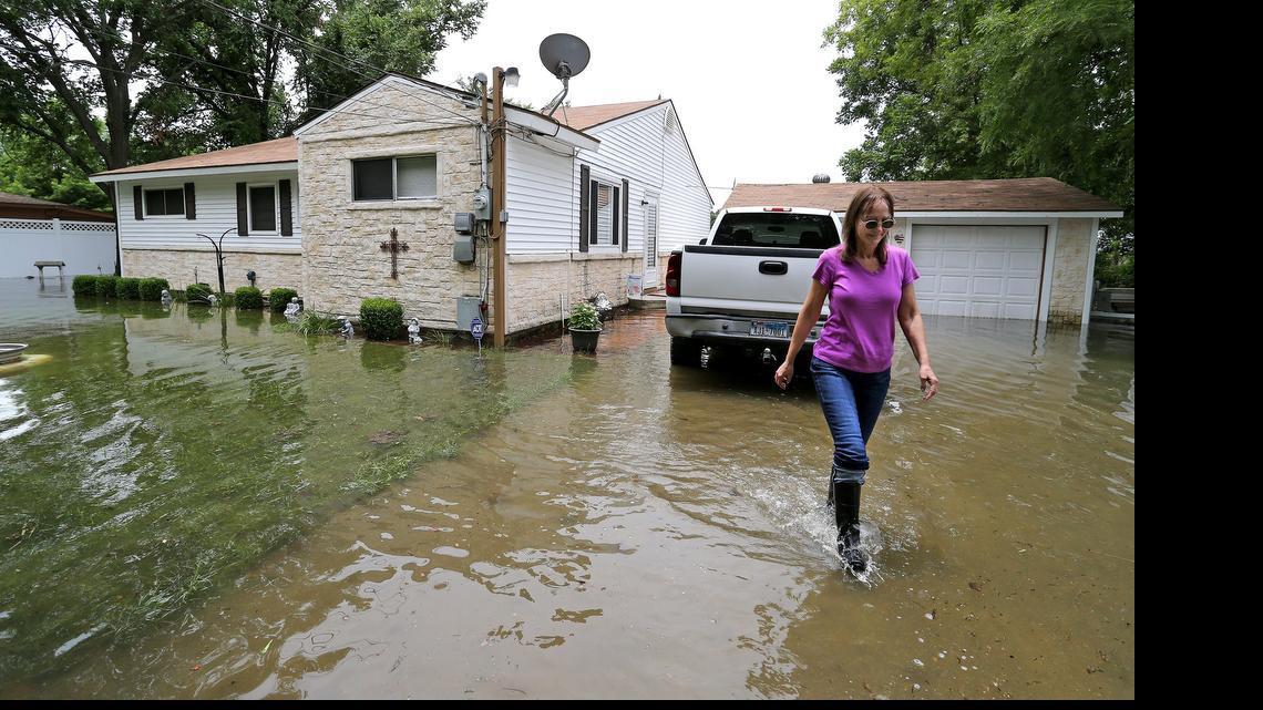 
Deana Davis walks from her home near Lake Worth on Saturday. 
