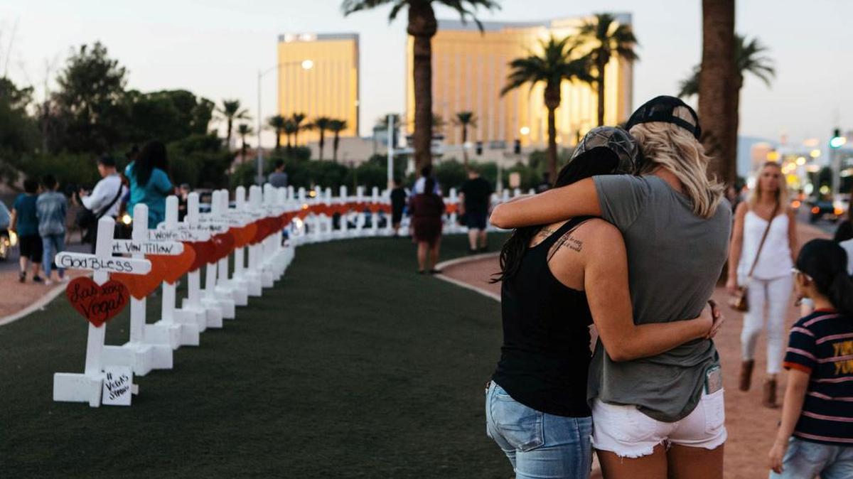 A memorial displaying 58 crosses stands at the "Welcome To Las Vegas Sign" in Las Vegas. Each cross has the name of a victim killed during the mass shooting Sunday, Oct. 1.