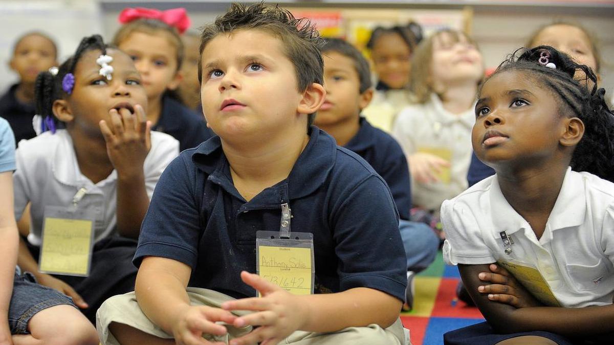 Kindergarten students listen to their teacher read a story at Western Hills Primary School in Fort Worth in this 2019 file photo. New data shows that Pre-K works to help students with phonological awareness, key to later success in reading.