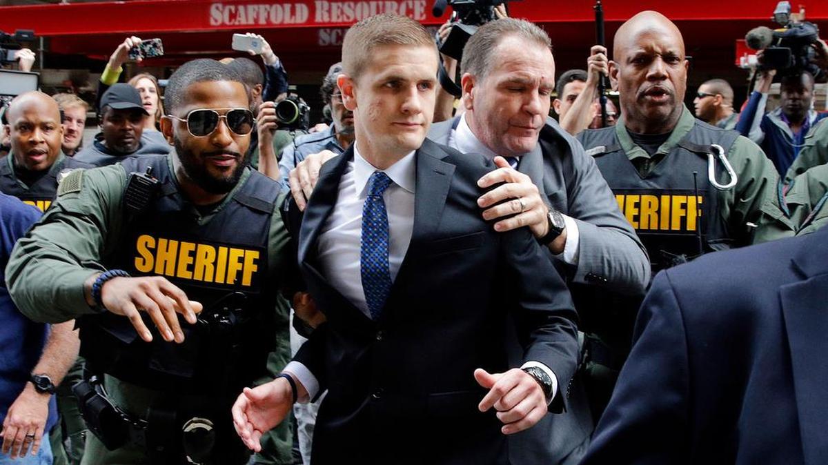 John Nero, center left, one of six Baltimore police officers charged in connection to the death of Freddie Gray