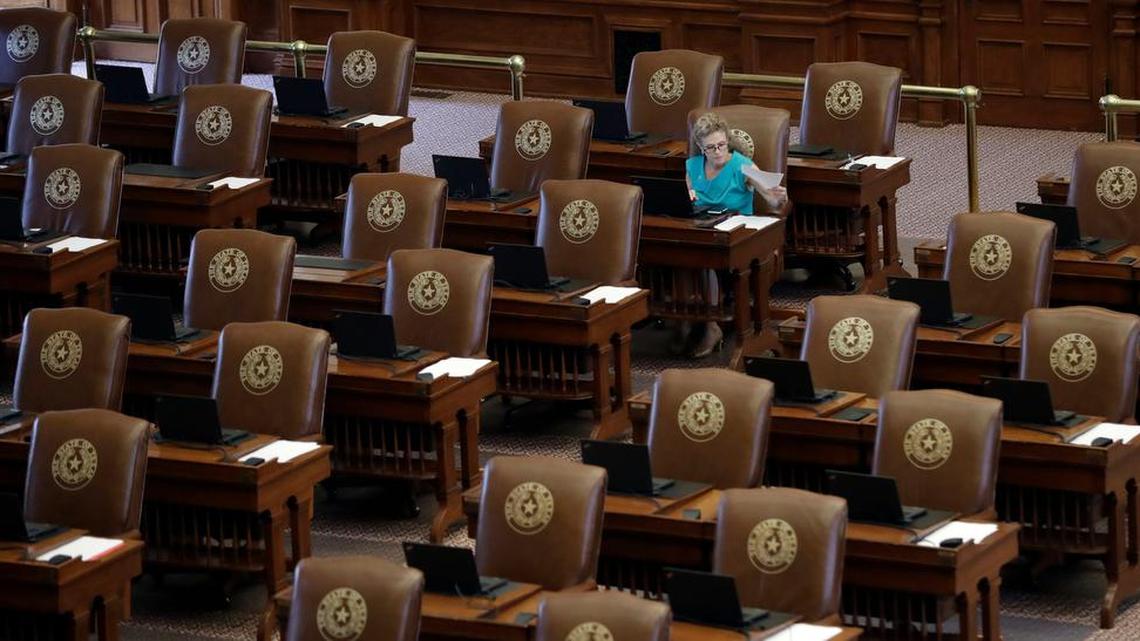 Texas Rep. Donna Howard, D-Austin, works at her desk as she waits for the House to convene, Tuesday, Aug. 15, 2017, in Austin. The special session will end Wednesday with the Texas 'bathroom bill' expected to fail.