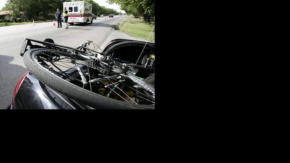
A bicycle rests in the trunk of a Haltom City police car after a 2012 accident on Denton Highway. 
