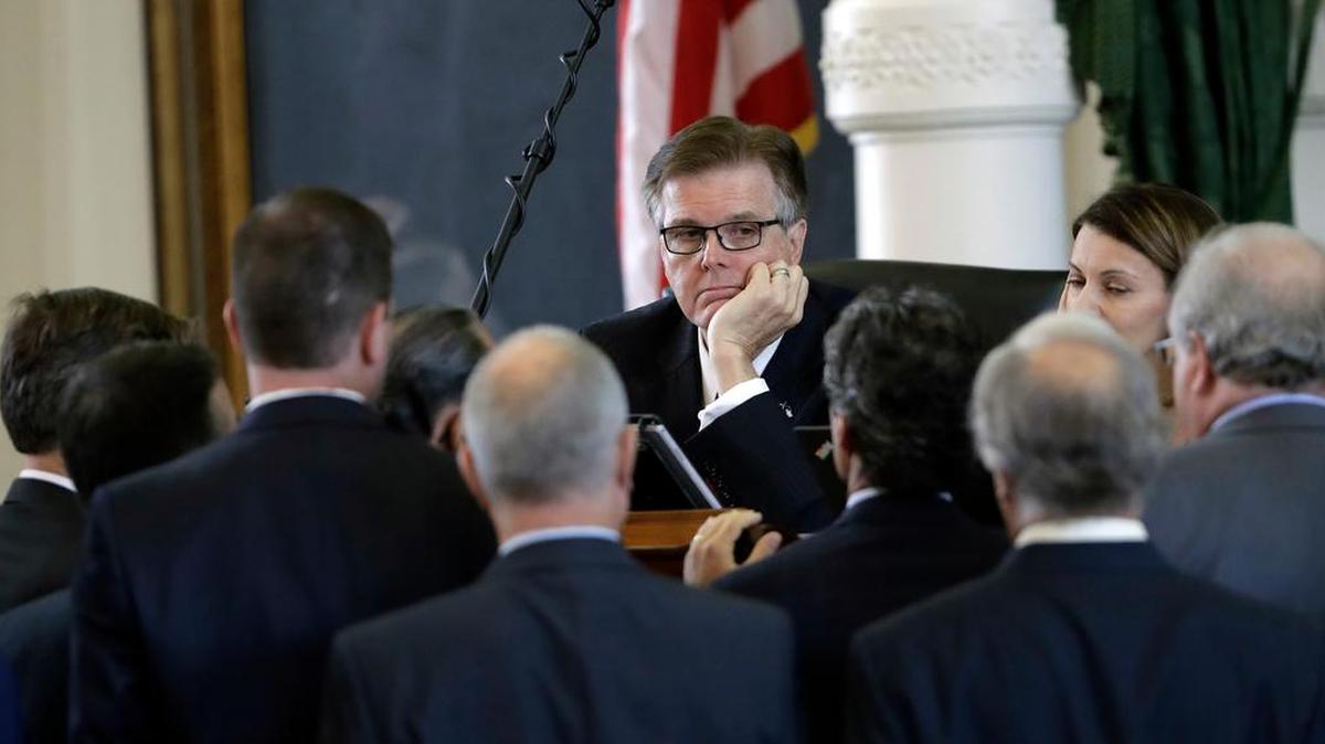 Texas Lt. Gov. Dan Patrick, center, listens to fellow lawmakers during a point of order discussion in the Senate Chambers in Austin, Tuesday.