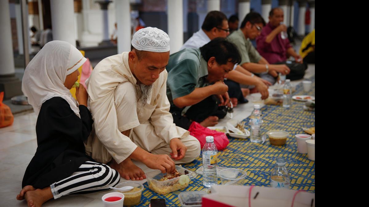 
A Muslim family in Malaysia breaks their fast Thursday on the first day of the Islamic holy month of Ramadan.
