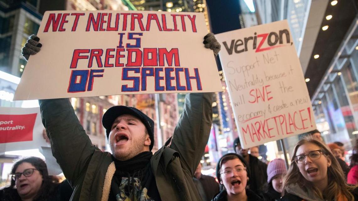 Demonstrators rally in support of Net Neutrality outside a Verizon store, Thursday, Dec. 7, 2017, in New York. The FCC is set to vote Dec. 14 whether to scrap Obama-era rules around open internet access that prevent phone and cable companies from favoring certain websites and apps.