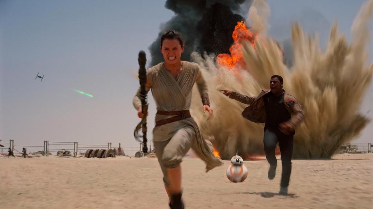 Rey (Daisey Ridley), left, and Finn (John Boyega) in Star Wars: The Force Awakens, directed by J.J. Abrams.