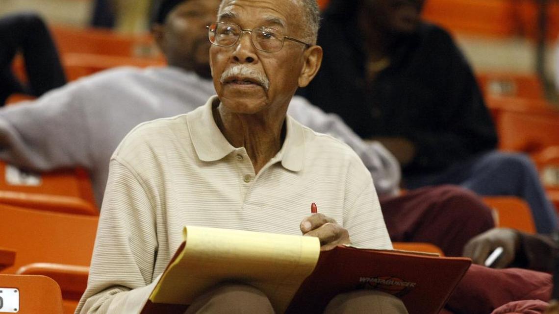Former Dunbar High School boys basketball coach Robert Hughes Sr. scouts a 2009 Dunbar game against O.D. Wyatt High School. Hughes retired in 2005.