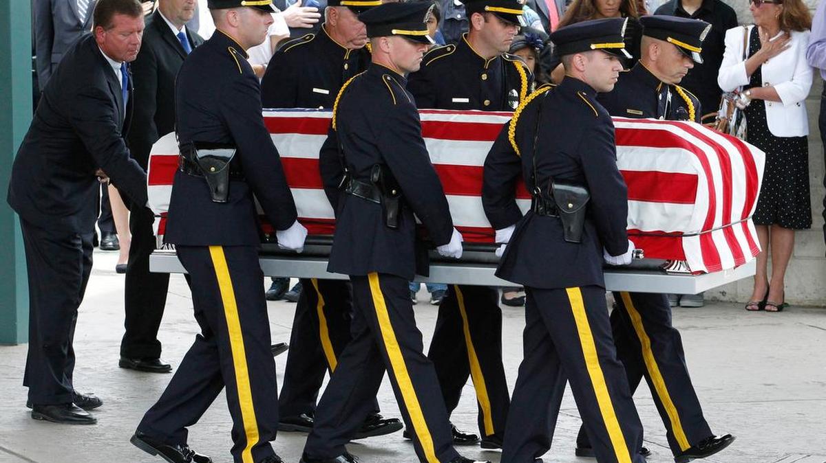 Dallas Police Honor Guard members carry Michael Krol's casket outside for the final salute. Funeral services for Dallas Police officer Michael Krol, one of five officers shot to death in a ambush July 7, 2016, were held at Prestonwood Baptist Church in Plano, Texas, Friday, July 15, 2016.