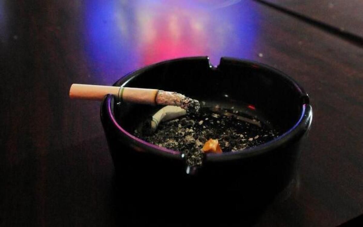 Smoking in the Draft House at J. Gilligan's Bar & Grill.