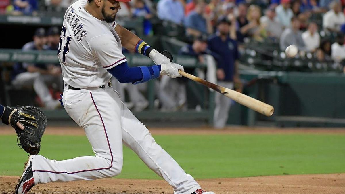 Rangers catcher Robinson Chirinos flew out to center field in the Sept. 13 game against the Mariners.