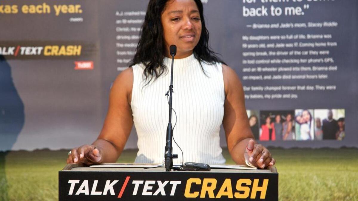 Stacey Riddle, who lost her only two daughters in a distracted driving-related crash in 2016, speaks at a “Talk, Text, Crash” event.