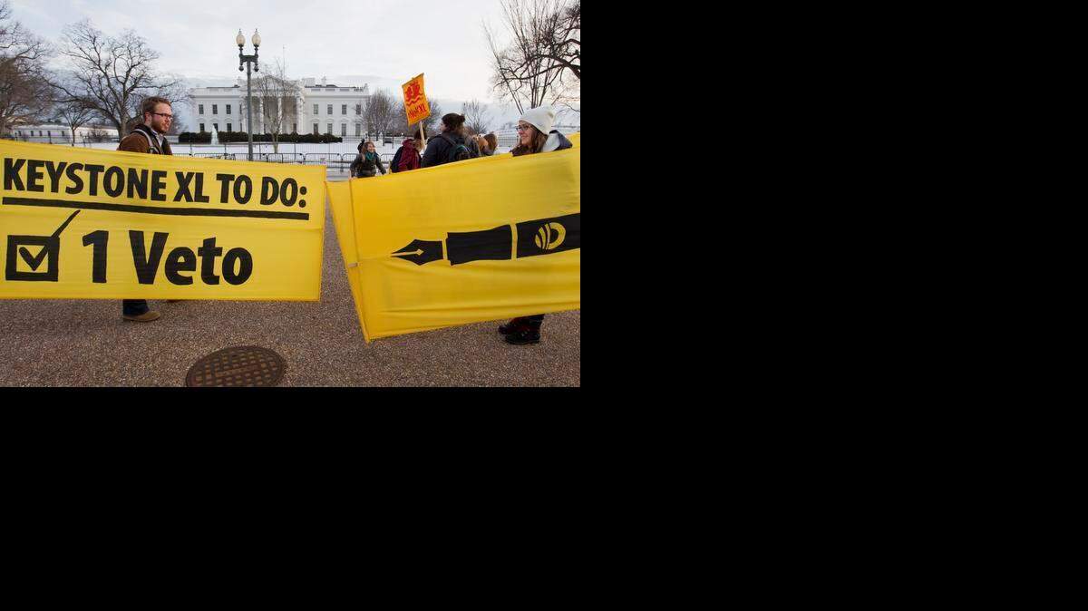 
Demonstrators celebrate outside the White House on Tuesday after President Obama’s veto of Keystone XL legislation. 
