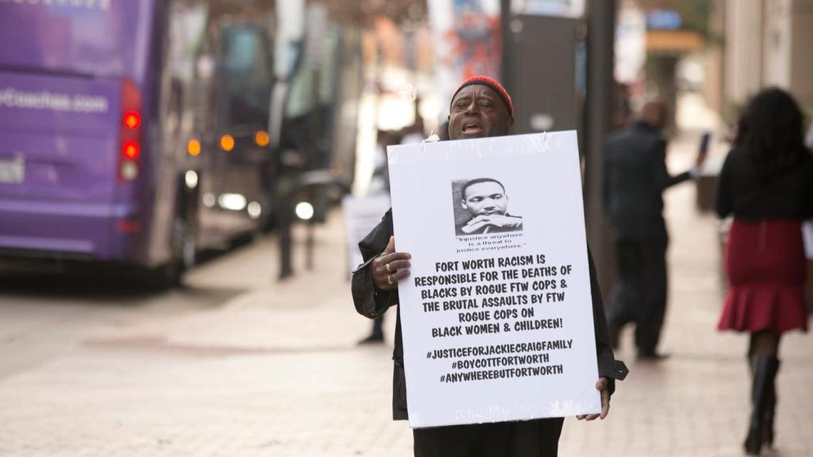 Oscar Sutphen gathers with other protesters at the Omni Hotel to remind people of the one year anniversary of the arrest of Jacqueline Craig and her two daughters, on Thursday, December 21, 2017.