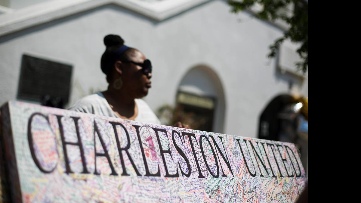 
A message board in memory of the shooting victims in front of Emanuel AME Church in Charleston, S.C. 
