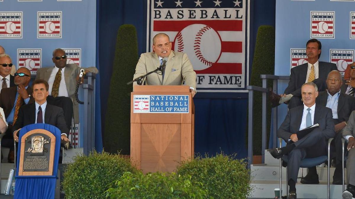 National Baseball Hall of Fame inductee Ivan "Pudge" Rodriguez, center, speaks during an induction ceremony at the Clark Sports Center, Sunday, July 30, 2017, in Cooperstown, N.Y.
