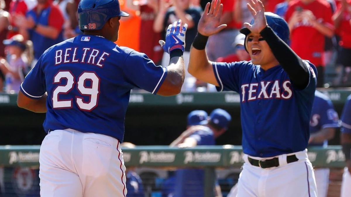 Texas Rangers’ Adrian Beltre celebrates with Shin-Soo Choo after a two-run home run against the Los Angeles Angels Oct. 4 at Globe Life Park in Arlington. The Rangers won 9-2, taking the American League West Division title.