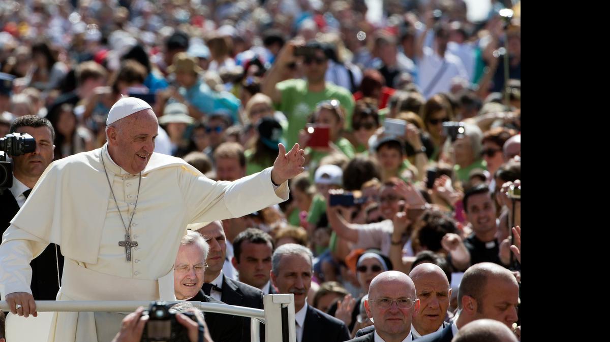 
Pope Francis waves as he arrives for his weekly general audience in St. Peter’s Square at the Vatican last Wednesday. 
