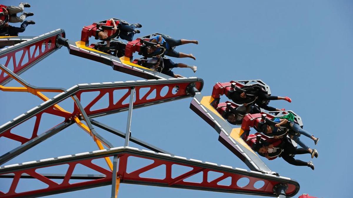 Invited guests got a ride on Catwoman Whip as Six Flags Over Texas introduced three new rides in May.