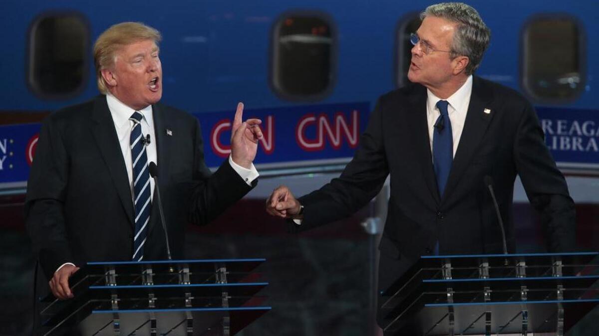 
Republican presidential candidates Donald Trump, left, and Jeb Bush spar early in Wednesday’s GOP presidential debate. 
