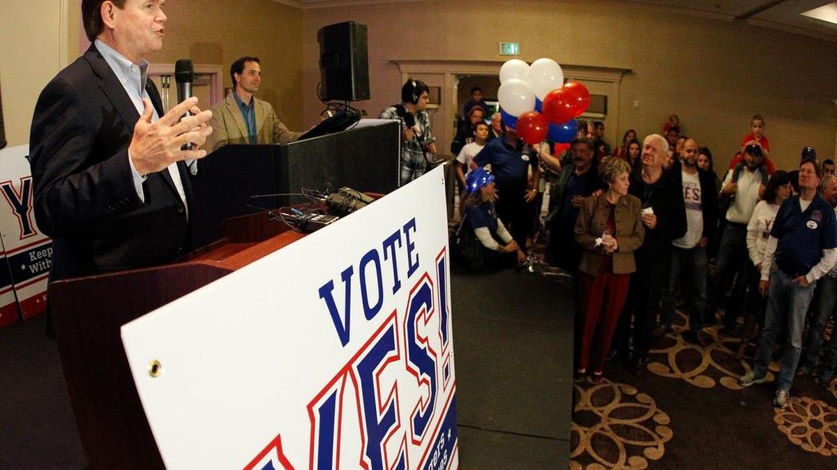 Arlington Mayor Jeff Williams (at podium) speaks to an election night crowd Tuesday as voters supported a new Texas Rangers stadium.