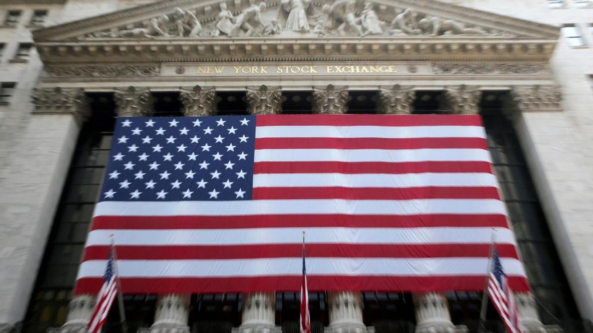 A giant American flag hangs on the facade of the New York Stock Exchange on Sept. 8, 2015.