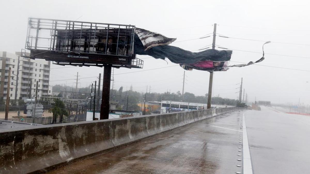 A Miami billboard is ripped apart by high winds as Hurricane Irma passes by earlier this month.