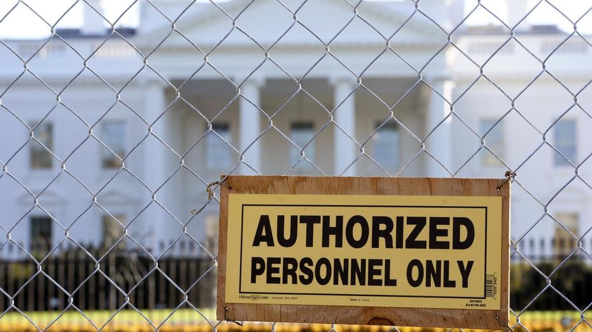 A sign on the security fence surrounding a construction area in front of the White House drew attention in 2012.