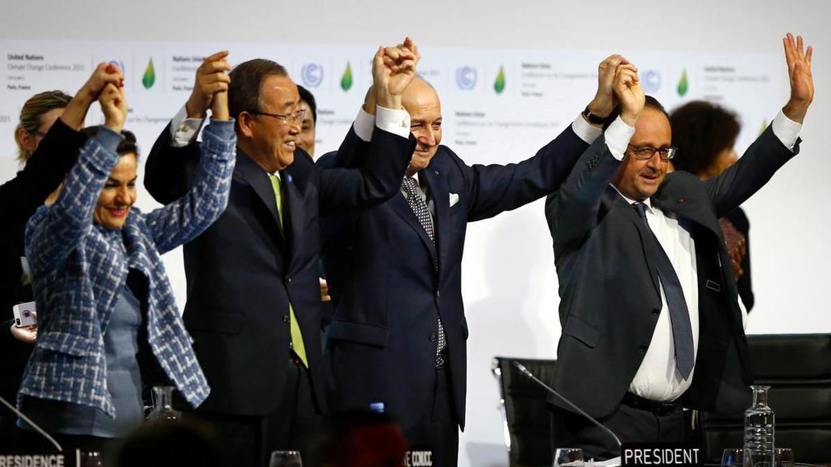 United Nations and French officials celebrate Dec. 12 after 200 governments reached climate agreement in Paris.