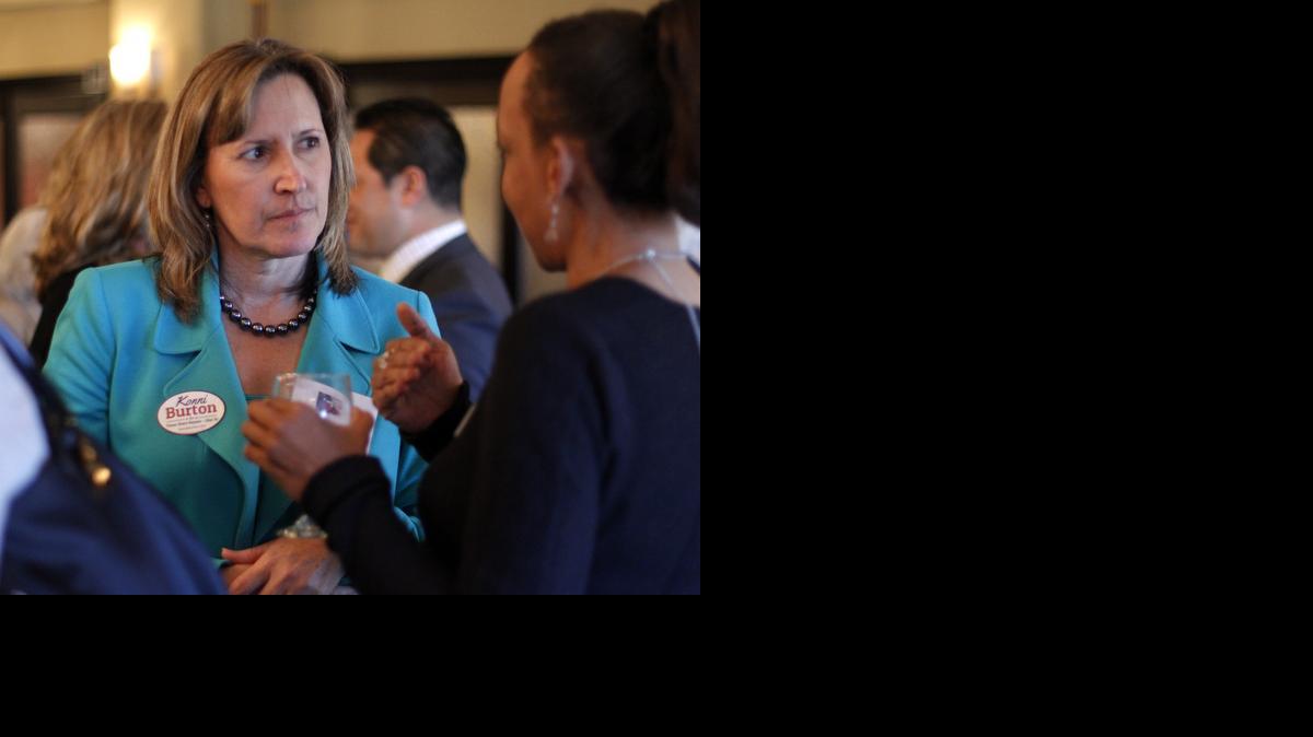 
State Sen. Konni Burton talks with a voter while campaigning last year for the District 10 seat. 
