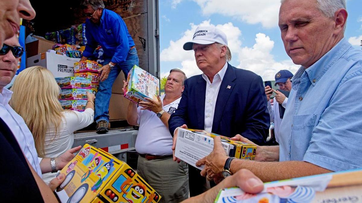Republican Donald Trump and running mate Mike Pence, right, unload flood relief supplies Aug. 19 in Louisiana.