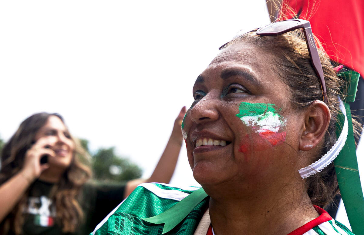Flor Rivera smiles while watching Mexico play against South Africa during the FIFA Fan Festival on Thursday, June 11, 2026, at Fair Park in Dallas. The last time FIFA hosted a World Cup match in Texas was 1994.