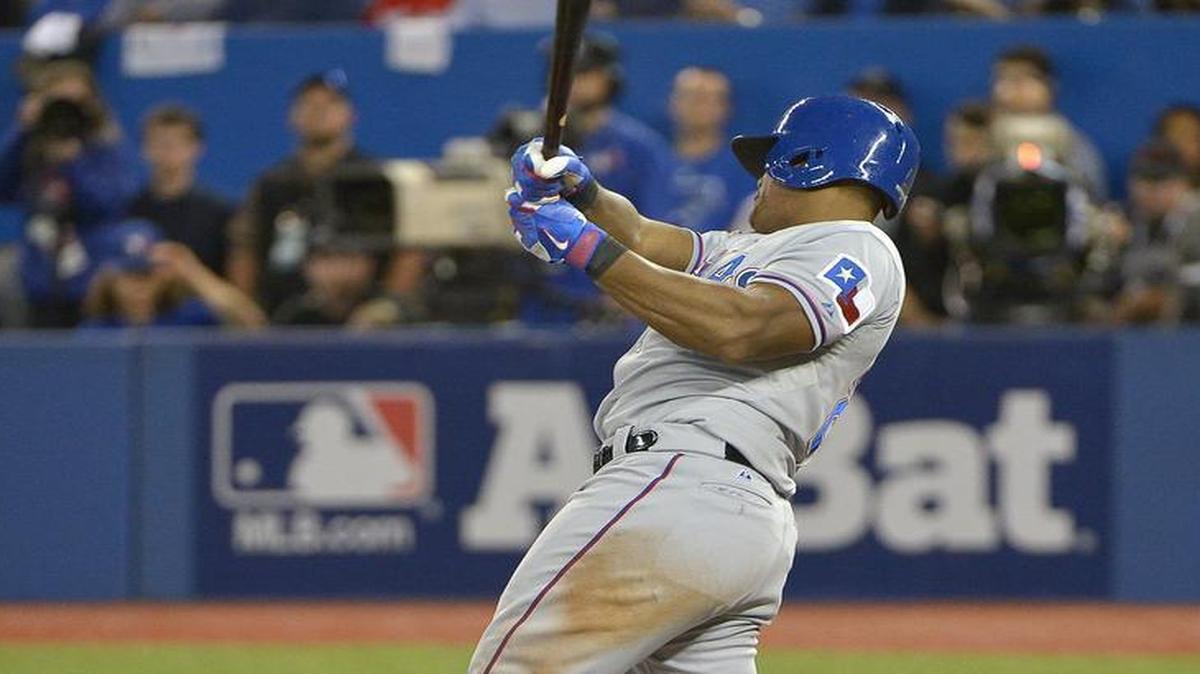 
This swing by Adrian Beltre produced an RBI single in Game 1, but he quickly left the game with a strained back.
