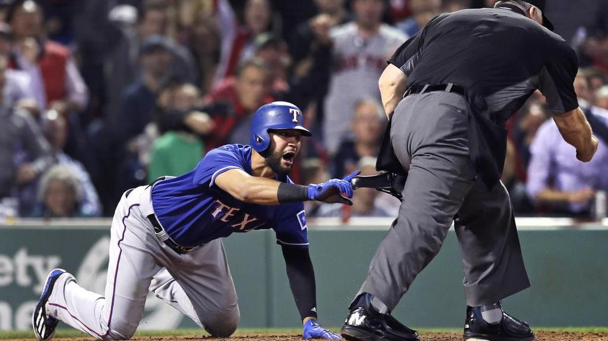 Texas Rangers outfielder Nomar Mazara, left, argues with home plate umpire Tim Welke in Tuesday’s loss to the Boston Red Sox. Mazara and the Rangers hope for a better outcome Thursday at Fenway Park in the finale of a three-game series. The game will be televised at 6 p.m. on Fox Sports Southwest.
