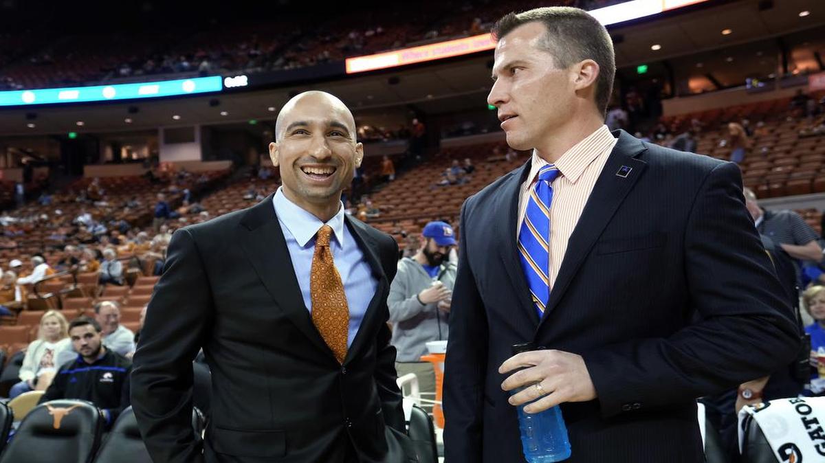 UT Arlington men’s basketball coach Scott Cross, right, with Texas coach Shaka Smart, and the Mavericks take on Loyola Marymount at 9 p.m. Thursday in yet another road test. The game will be broadcast on KEXB/620 AM.