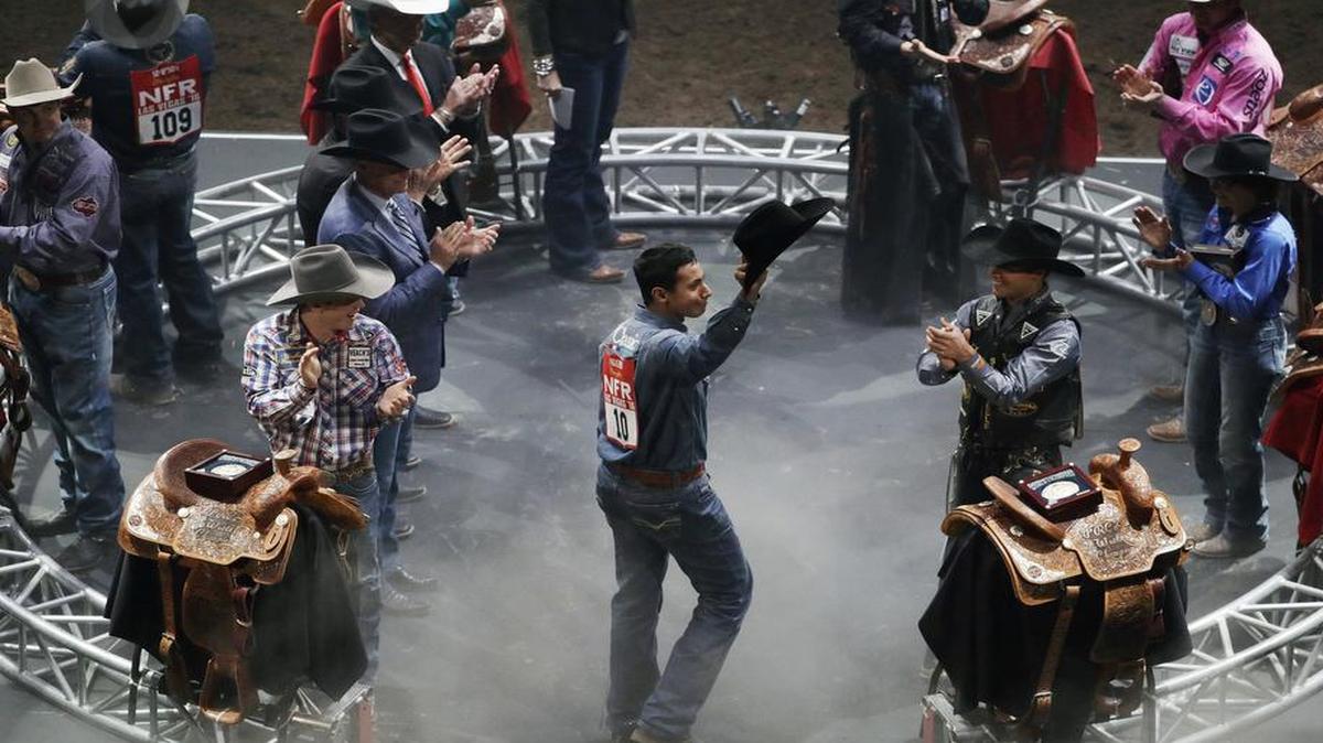 All-around champion Junior Nogueira tips his hat to the crowd during the final night of the National Finals Rodeo, Saturday, Dec. 10, 2016, in Las Vegas.