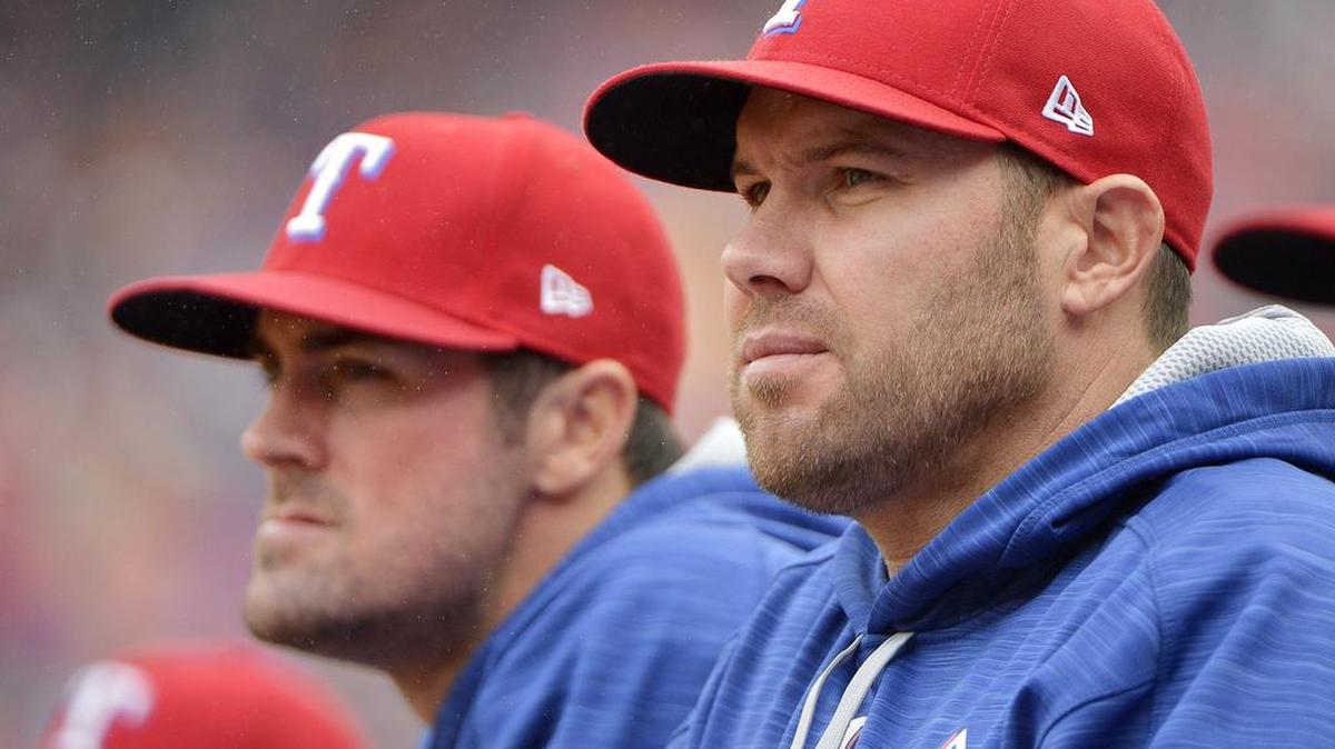 Texas Rangers starting pitcher Colby Lewis, right, will try to keep the Rangers’ season alive at 6:30 p.m. Sunday in Game 3 of the AL Division Series against the Toronto Blue Jays. Lewis and Rangers Game 1 starting pitcher Cole Hamels, left, watched the Rangers lose Game 2 on Friday at Globe Life Park in Arlington.