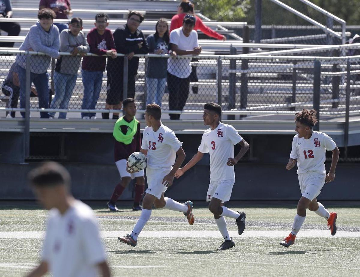 Sam Houston’s Jose Ortiz (15) takes the ball down the pitch while taunting the Lewisville sidelines after tying the game as Sam Houston played Lewisville in a 6A Region 1 Semifinal Soccer game at Dragon Stadium Friday April 7, 2017. Sam Houston defeated Lewisville 3-2 in overtime.