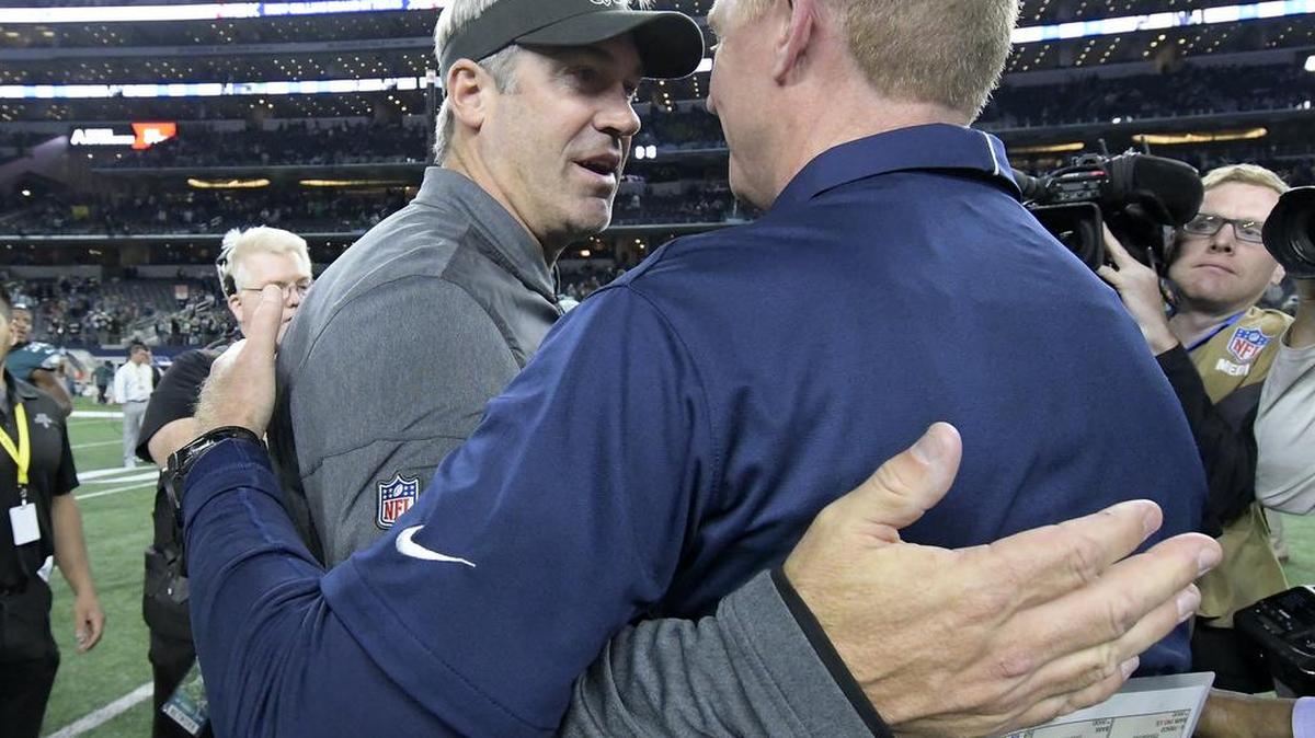 Dallas Cowboys head coach Jason Garrett and Philadelphia Eagles head coach Doug Pederson meet after the game as the Eagles beat the Cowboys 37 to 9 at AT&T Stadium in Arlington, TX, Sunday, Nov. 19, 2017.