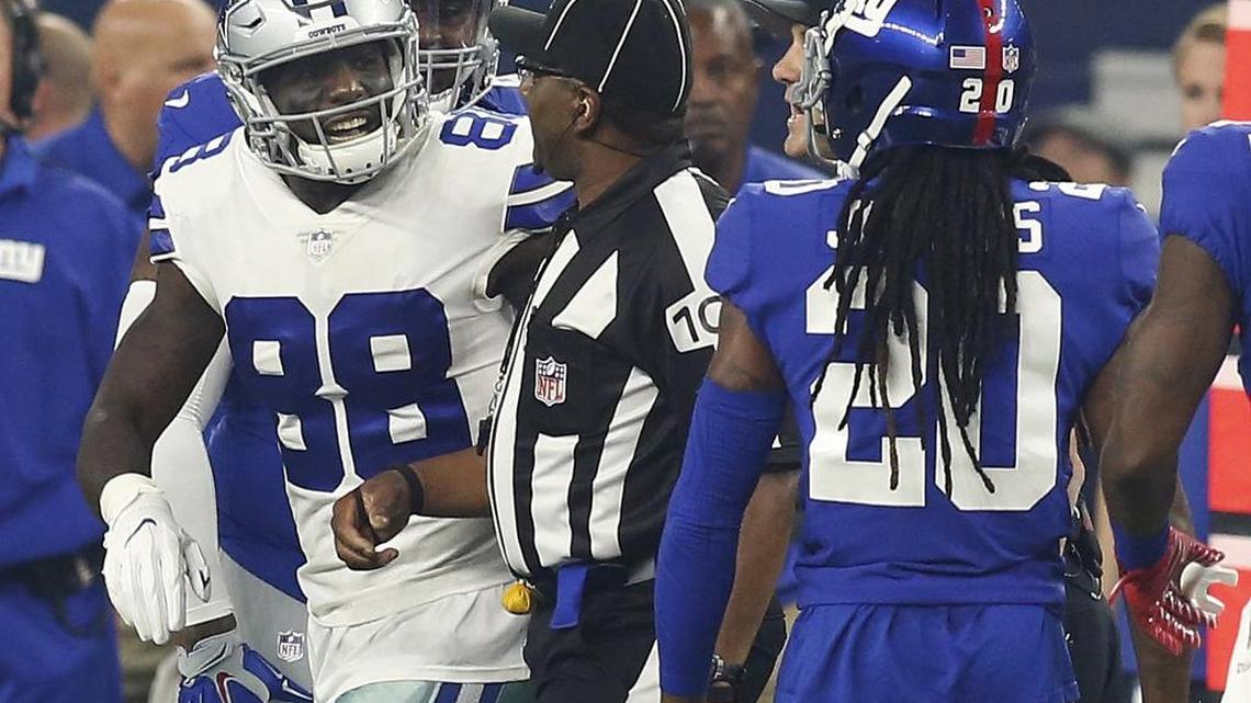 Down judge Tom Symonette, center, separates Dallas Cowboys wide receiver Dez Bryant (88) and New York Giants cornerback Janoris Jenkins (20) during the first half of an NFL football game in Arlington, Sunday, September 10, 2017. Police told ESPN's Dianna Russini on Tuesday that they are investigating the discovery of a body at Jenkins' New Jersey home.
