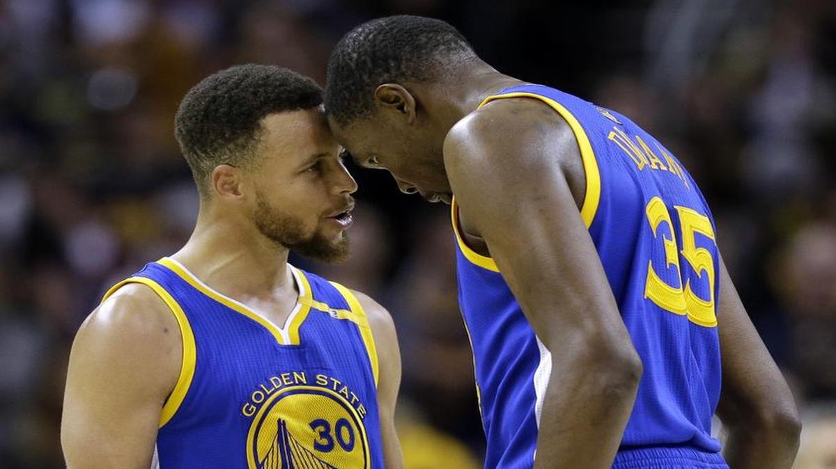 Stephen Curry, left, Kevin Durant and the Golden State Warriors try to clinch the NBA championship Friday when they take on the Cavaliers in Cleveland in Game 4 of the NBA Finals. Durant, seeking his first title, helped the Warriors rally for a victory Wednesday in Game 3 to take a commanding 3-0 lead. Friday’s game will be televised at 8 p.m. on ABC (WFAA/Ch. 8).